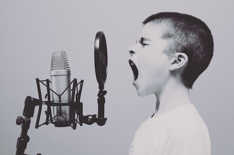 Child shouting at a microfone